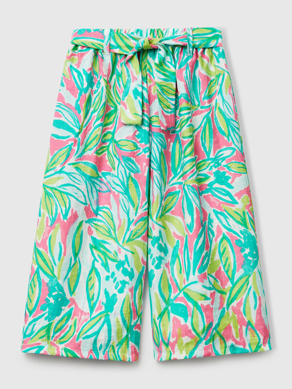 Pantalón palazzo con estampado tropical Niña